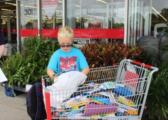 Delmarvans Donate Three Shopping Carts of Items to Rotary Book Bag Project