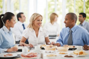 Businesspeople having lunch indoors.