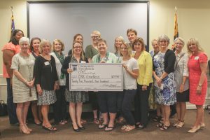 Group of women accepting oversized check