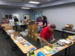 room full of tables with brochures