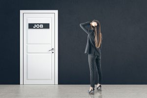 Businesswoman Looking On White Door With Job Sign. Business And