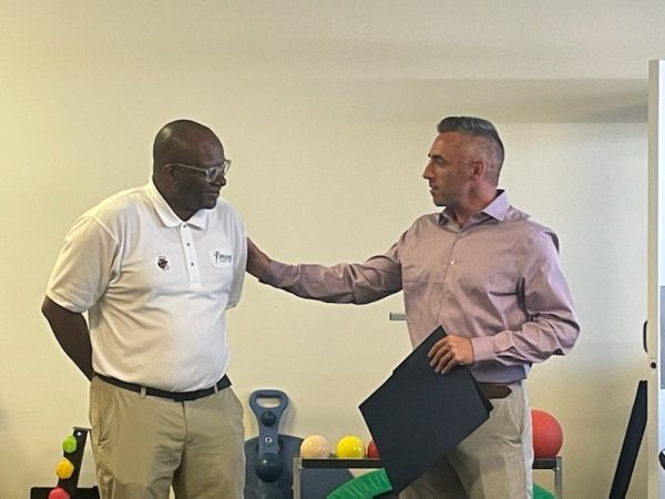 Major Jacob Day presenting certificate and citation to Dr. Briddell ...