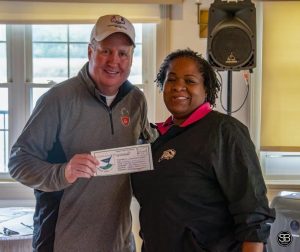 man and woman holding gift certificate