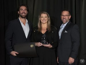 Gavin and Sara Aquino of Atlantic Portable X-Ray accept the Small Business of the Year Award winner from Jim Fuss of BBSI