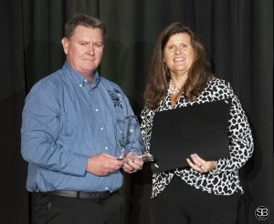Steve McGee. Chesapeake Shipbuilding, accepts Business Professional of the Year Award from Dr. Christy Weer, Perdue School of Business