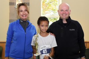 man and woman standing with female 5k winner