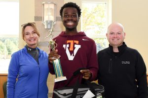 man and woman standing with male 5k winner