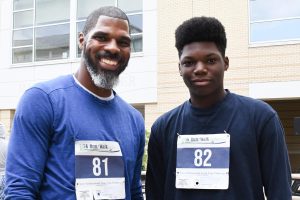 father and son runners wearing 5k run/walk numbers