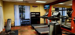 Fintess room with treadmills and free weights