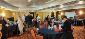 Group of people mingling in a hotel banquet room