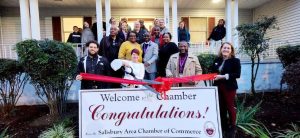 group of people at ribbon cutting