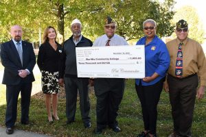 vfw members holding donation check