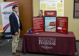 Jared Shelton, Chesapeake Utilities stops by the Perdue School of Business exhibit table
