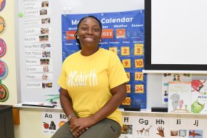 Smiling girl in a yellow tshirt