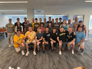 group of staff in office wearing Pittsburgh gear