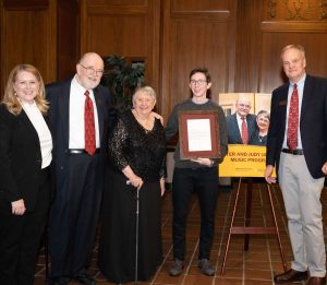 group of people with award