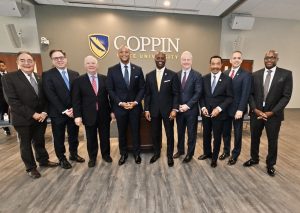 group of men standing together at coppin state university