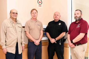 four men standing together