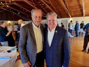 two men standing together at event