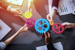 group of hands holding marketing wheels