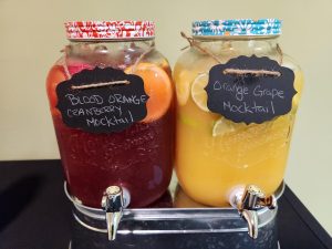 two glass jars with mocktails