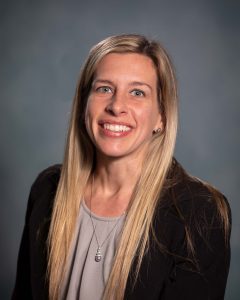 headshot of female with blonde hair smiling