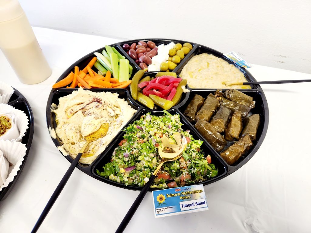 Hummus Tabouli Salad Dolma stuffed leaves olives feta are part of this wonderful and healthy appetizer tray