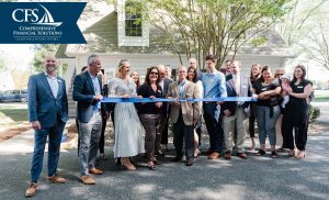 group of people at ribbon cutting