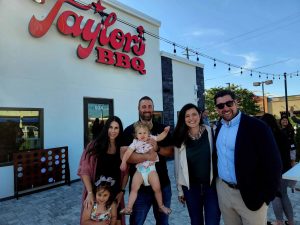 group standing outside Taylor's BBQ