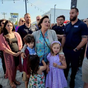 group of people standing outside Taylor's BBQ