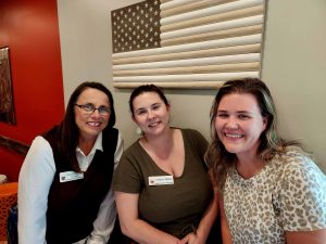 three ladies sitting at Taylor's BBQ