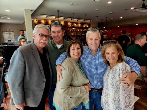 group of people standing in bar at Taylor's BBQ