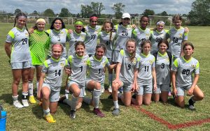 team of girls wearing uniforms outside