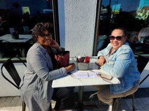 two ladies sitting on patio at Taylor's BBQ