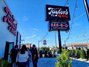 Taylor's BBQ front patio with people gathering