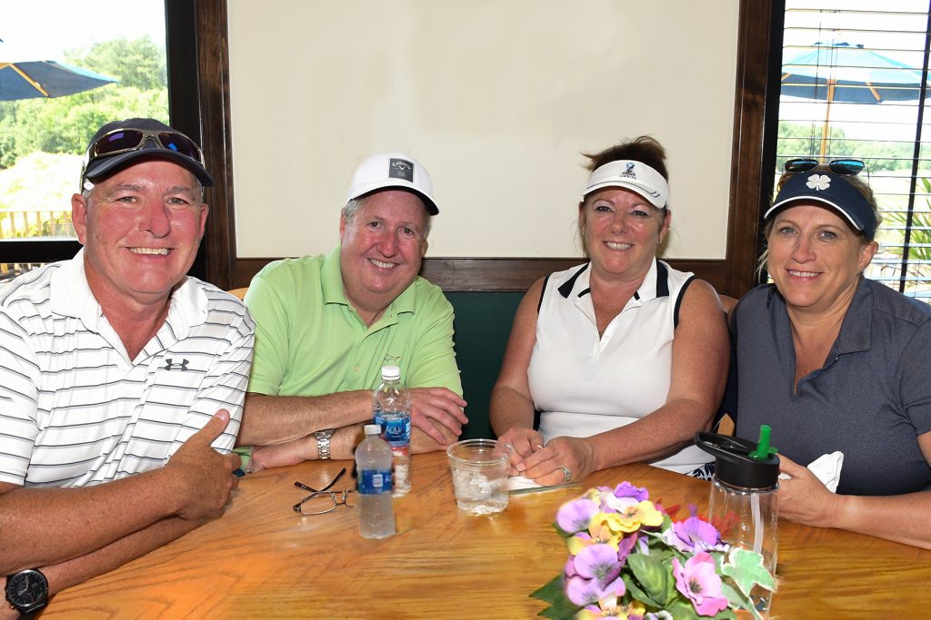 From left, Ralph Davis, Bill Chambers, Cindy Chambers and Linda Davis of the Salisbury Chamber of Commerce team wait to see if they won the raffle after the Wor-Wic Community College golf tournament held at the college’s Ocean Resorts Golf Club in Berlin.