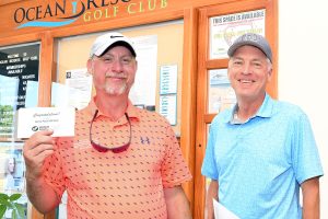 From left, Eugene Jubber and Dave Ryan collect prizes won at the Wor-Wic Community College golf tournament held at the college’s Ocean Resorts Golf Club in Berlin.