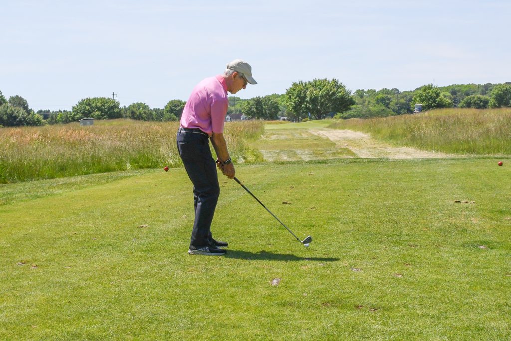 Bill Rinnier prepares to hit at the eighth hole of the Wor-Wic Community College golf tournament held at the college’s Ocean Resorts Golf Club in Berlin.