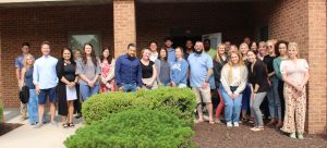 group of realtors standing outside building