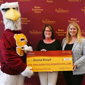 donna knopf holding check with sammy the seagull and su president