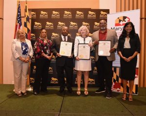 lieutenant governor aruna miller presenting awards to business owners