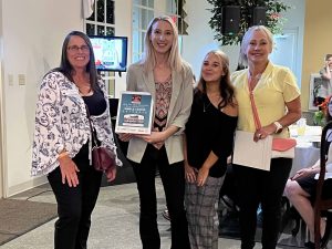 brew river winners holding award at event