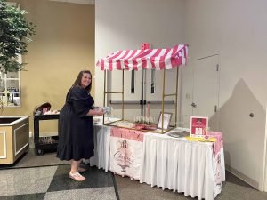 owner of chelsea's creative confections at event table