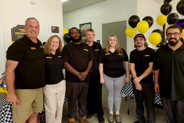 Meineke's co-owners Mike Keesley and Jennifer Runyon, with staff L-R Juwan Wilson, Dustin Mills, Lucia Vicidomini, Austin Lewis and Brandon Kelley