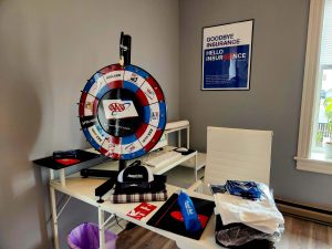 desk with AAA spin wheel and giveaways