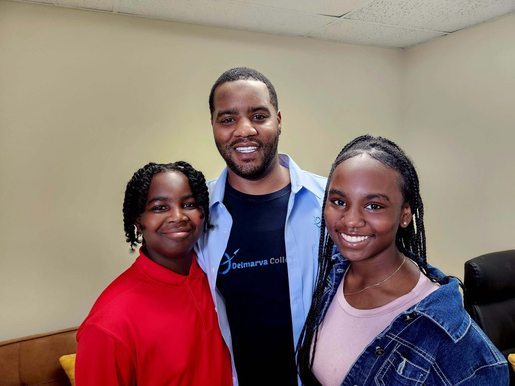 african american male standing with son and daughter