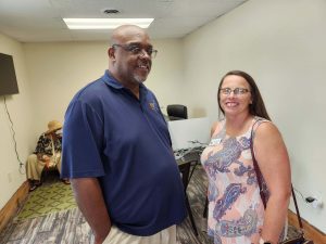 two people standing together at event