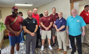 group of men standing together at event