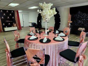 event room with table and chairs decorated