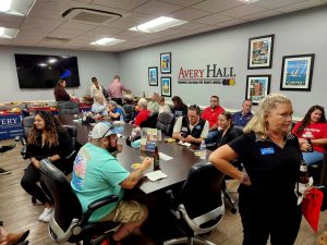 Business After Hours attendees sitting around a conference room table